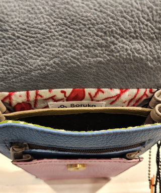 Close-up of a textured gray surface with a brand label visible.