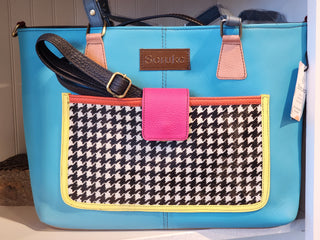 Blue handbag with a houndstooth patterned pocket and pink accent, featuring the brand 'Sonku'.